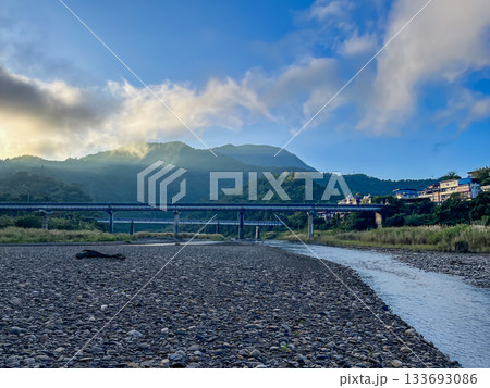 Wulai river valley with bridge and mountains in autumn morning, Taiwan. Wulai river valley with bridge and mountains in autumn morning, Taiwan. 133693086