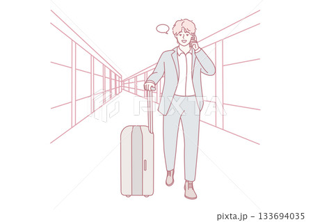 Traveler on move, Person in formal attire hurriedly moves through terminal with travel plans visible Traveler on move, Person in formal attire hurriedly moves through terminal with travel plans visible 133694035