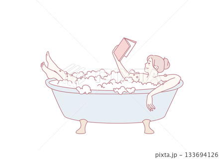 Young woman relax in bath reading book 133694126