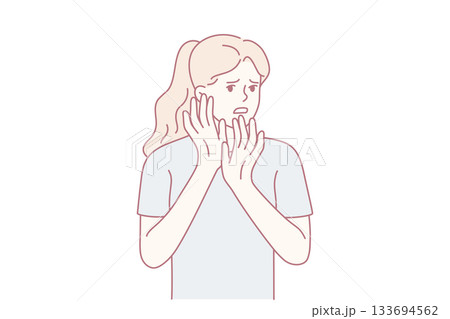 Expressive surprised woman, Delicate hands hide shocked face, Freelancer reacts to sudden unexpected news 133694562
