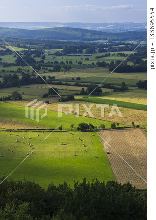 French Pyrenees rural landscape showing farmlands and hay bales 133695554