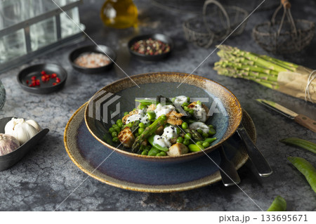 Fresh asparagus and pea salad with chicken and yogurt 133695671