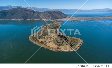 Prespa National Park. Greece. Agios Achillios Drone Shot. Amazing Lake. Island Prespa National Park. Greece. Agios Achillios Drone Shot. Amazing Lake. Island 133695811