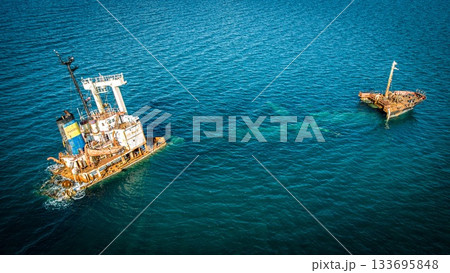 Manassa Rose Shipwreck. Crete. Greece. Aerial Shot. 90 degree take. Blue water Manassa Rose Shipwreck. Crete. Greece. Aerial Shot. 90 degree take. Blue water 133695848