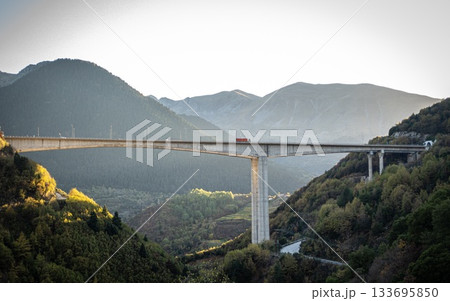 Highway Bridge from Metsovo and Anilio. Red Truck. European route E90 Highway Bridge from Metsovo and Anilio. Red Truck. European route E90 133695850