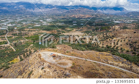 Aerial View of Olive Trees sorrounding Phaistos Palace. Crete. Greece. 133695851