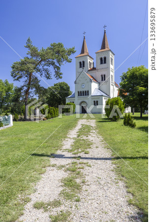 White church in Bina, Slovakia with twin spires White church in Bina, Slovakia with twin spires 133695879