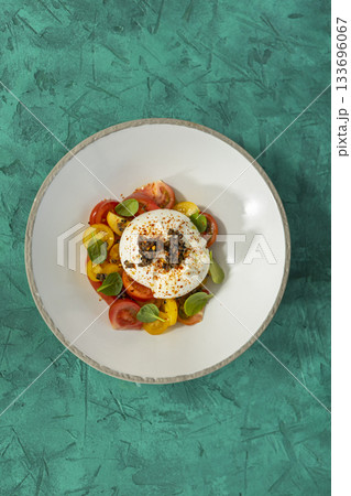 Burrata cheese salad with fresh colorful tomatoes Burrata cheese salad with fresh colorful tomatoes 133696067