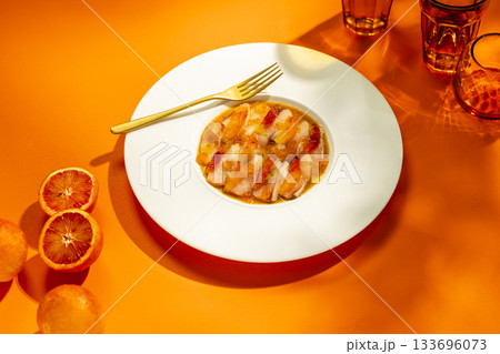 Fine dining seafood ceviche with blood orange dressing 133696073