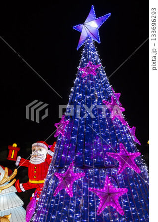 Christmas tree with blue lights and Santa Claus lantern Christmas tree with blue lights and Santa Claus lantern 133696293