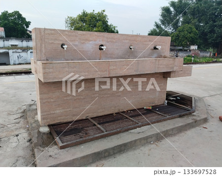 water tap facility provided by Indian Railways for passengers at Railway Station. 133697528