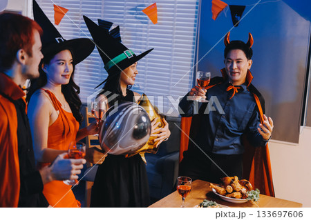 Joyful office Halloween party with coworkers in costumes, celebrating with drinks and laughter, fostering teamwork and festive spirit Joyful office Halloween party with coworkers in costumes, celebrating with drinks and laughter, fostering teamwork and festive spirit 133697606