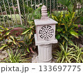 traditional old stone lantern in india garden. 133697775