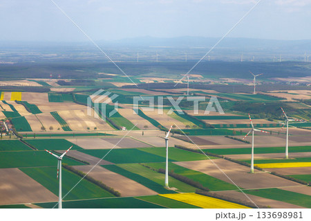 Wind turbines stand tall over vibrant farmland in countryside Vienna, Austria Wind turbines stand tall over vibrant farmland in countryside Vienna, Austria 133698981