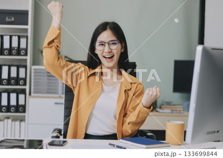 Business woman using calculator for do math finance on wooden desk in office and business working background, tax, accounting, statistics and analytic research concept. Business woman using calculator for do math finance on wooden desk in office and business working background, tax, accounting, statistics and analytic research concept. 133699844