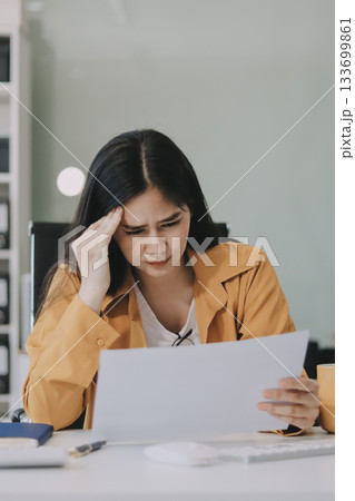 Headache, business woman at night and computer stress while working for a deadline with pc glitch. Sad corporate manager with anxiety about target working at desk screen late to complete task online Headache, business woman at night and computer stress while working for a deadline with pc glitch. Sad corporate manager with anxiety about target working at desk screen late to complete task online 133699861