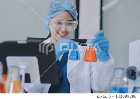 Portrait, science and happy woman on laptop in lab to research chemistry, test or innovation. Microscope, scientist and face of medical doctor in goggles for microbiology, healthcare or pharma study Portrait, science and happy woman on laptop in lab to research chemistry, test or innovation. Microscope, scientist and face of medical doctor in goggles for microbiology, healthcare or pharma study 133699896