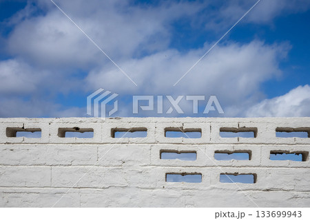 White fence and sky with clouds, Spain White fence and sky with clouds, Spain 133699943