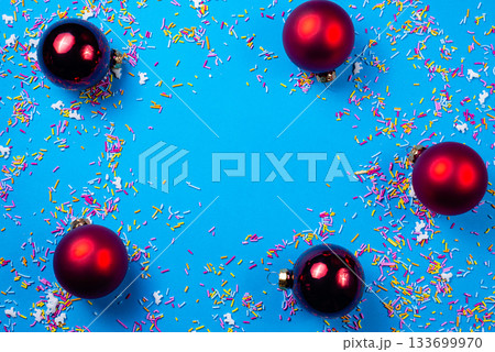 Red Christmas balls on a blue background. Happy New Year and Christmas designs With space for text. 133699970