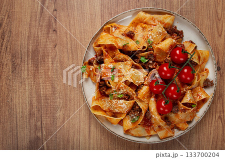 pappardelle pasta with bolognese sauce, topped with parmesan cheese and cherry branch, homemade, no people, pappardelle pasta with bolognese sauce, topped with parmesan cheese and cherry branch, homemade, no people, 133700204