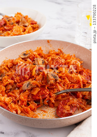 Bigos, Polish dish bigos, on the table, pan with stewed meat, with cabbage, chorizo sausages, mushrooms, homemade, without people, Bigos, Polish dish bigos, on the table, pan with stewed meat, with cabbage, chorizo sausages, mushrooms, homemade, without people, 133700228