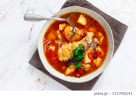 Souzi soup. Georgian dish, meat with oats, tomato sauce and herbs, 133700241