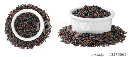 Black wild rice in ceramic bowl isolated on white background close up. Top view. Flat lay Black wild rice in ceramic bowl isolated on white background close up. Top view. Flat lay 133700634