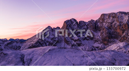 Panoramic view of Dolomite mountain peaks in beautiful morning light. Early winter scene with snow-covered summits, captured in high resolution. perfect for large fine art prints. Panoramic view of Dolomite mountain peaks in beautiful morning light. Early winter scene with snow-covered summits, captured in high resolution. perfect for large fine art prints. 133700972