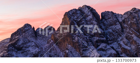 Panoramic view of Dolomite mountain peaks in beautiful morning light. Early winter scene with snow-covered summits, captured in high resolution. perfect for large fine art prints. Panoramic view of Dolomite mountain peaks in beautiful morning light. Early winter scene with snow-covered summits, captured in high resolution. perfect for large fine art prints. 133700973