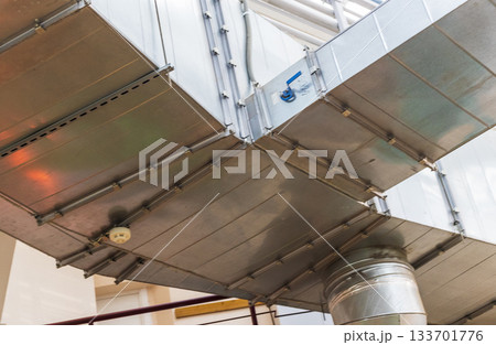 The photograph displays an industrial ventilation system The photograph displays an industrial ventilation system 133701776