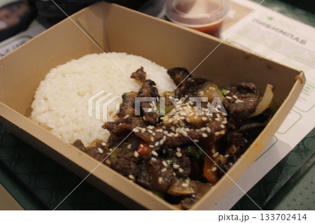 Korean Food Rice with Meat and Water Rolls in a Disposable Container. Korean Food Rice with Meat and Water Rolls in a Disposable Container. 133702414