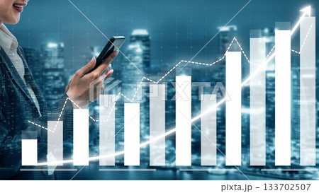 Businesswoman Holding Smartphone While Analyzing Data Graphs and Financial Growth Trends in a Modern Urban Environment at Night Copula Businesswoman Holding Smartphone While Analyzing Data Graphs and Financial Growth Trends in a Modern Urban Environment at Night Copula 133702507
