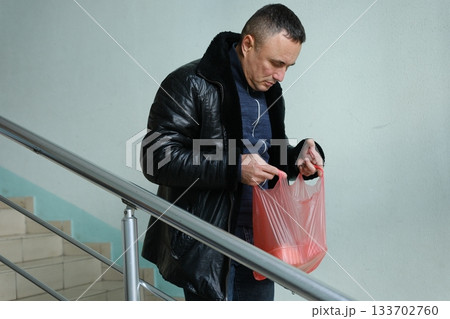 Smiling Senior Gentleman In Kitchen Posing With Grocery Bag After Food Shopping, Happy Elderly Man Holding Package With Fresh Vegetables And Fruits And Looking At Camera, Enjoying Healthy Eating Smiling Senior Gentleman In Kitchen Posing With Grocery Bag After Food Shopping, Happy Elderly Man Holding Package With Fresh Vegetables And Fruits And Looking At Camera, Enjoying Healthy Eating 133702760