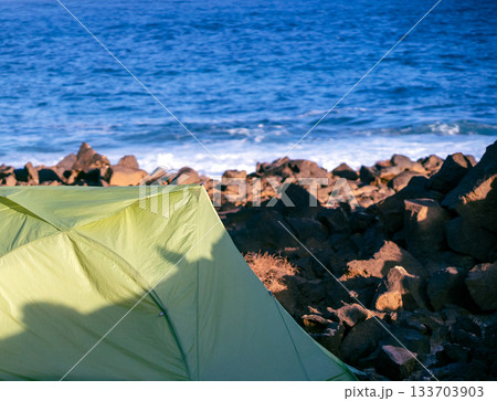 A tent for travelling and camping on the ocean coast background. 133703903