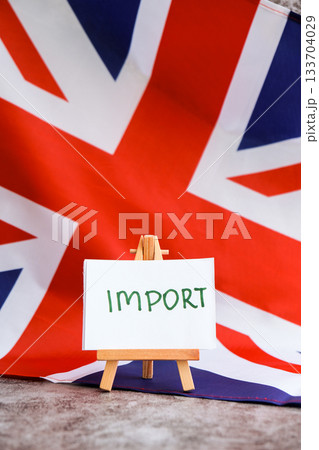 Paper note with words IMPORT on National symbol of Great Britain. British wave the UK silky flag background. Economy industry global market international shipping Paper note with words IMPORT on National symbol of Great Britain. British wave the UK silky flag background. Economy industry global market international shipping 133704029