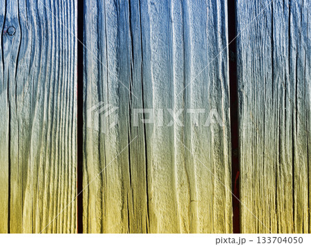 Wooden plank background in Ukrainian style, painted in the colors of the Ukrainian flag 133704050