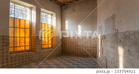 Abandoned Room with Old Yellow Windows and Sunlight 133704921