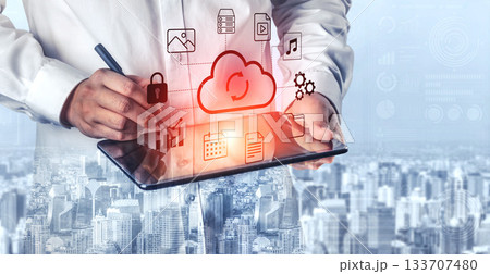 Business Professional Holding Tablet with Cloud Technology Interface and Digital Icons in Modern Cityscape Background Gantry Business Professional Holding Tablet with Cloud Technology Interface and Digital Icons in Modern Cityscape Background Gantry 133707480