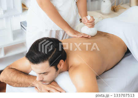 Hot herbal ball spa massage body treatment at day spa . Quiescent Hot herbal ball spa massage body treatment at day spa . Quiescent 133707513
