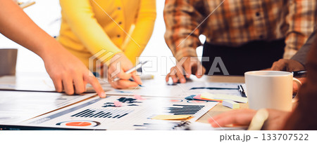 Team Collaboration During Business Meeting with Papers, Charts, and Colorful Sticky Notes on Table in Bright Office Environment SACTR Team Collaboration During Business Meeting with Papers, Charts, and Colorful Sticky Notes on Table in Bright Office Environment SACTR 133707522