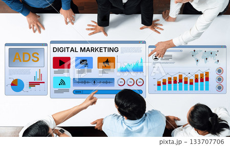 Group of professionals analyzing digital marketing data with graphs and charts on a modern touchscreen display in a bright office setting Trope Group of professionals analyzing digital marketing data with graphs and charts on a modern touchscreen display in a bright office setting Trope 133707706