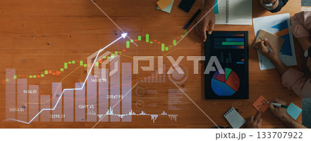 Financial Analysis Meeting with Charts, Graphs, and Data Visualizations Representing Market Trends and Performance Metrics on Wooden Table Scalp Financial Analysis Meeting with Charts, Graphs, and Data Visualizations Representing Market Trends and Performance Metrics on Wooden Table Scalp 133707922