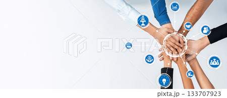 Diverse Hands Forming a Collaborative Symbol with Digital Icons Representing Success, Teamwork, and Innovation in a Modern Business Environment. Amity 133707923