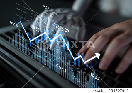 Robotic hand interacting with keyboard while displaying financial data and graphs on screen, illustrating AI technology in finance and investment sectors Scalp 133707942