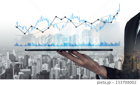 Businessman Holding Tablet with Financial Graphs and Charts Over City Skyline Background for Stock Photo Use in Finance and Technology Themes Scalp Businessman Holding Tablet with Financial Graphs and Charts Over City Skyline Background for Stock Photo Use in Finance and Technology Themes Scalp 133708002