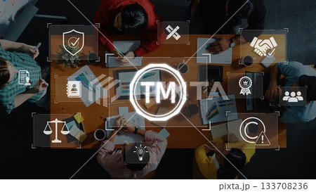 Collaborative Business Meeting with Technology Icons Representing Brand Management, Teamwork, and Intellectual Property Protection. Raster 133708236
