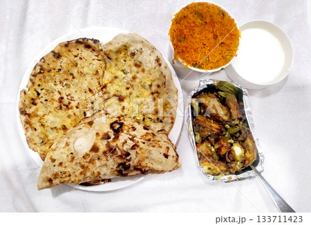 North Indian Meal with Paratha, Rice, Curry and Curd 133711423