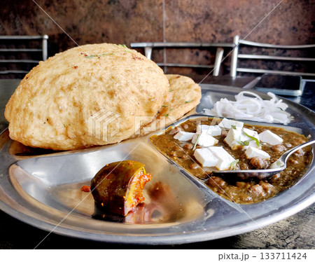 Chole bhature is a North Indian famous food dish. 133711424