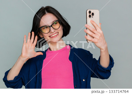 Young woman blogger taking portrait selfie record video call online with social media subscribers Young woman blogger taking portrait selfie record video call online with social media subscribers 133714764
