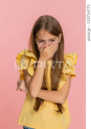 Child girl kid pretending to cry and lowering head with sad emotional expression in dramatic gesture 133714771